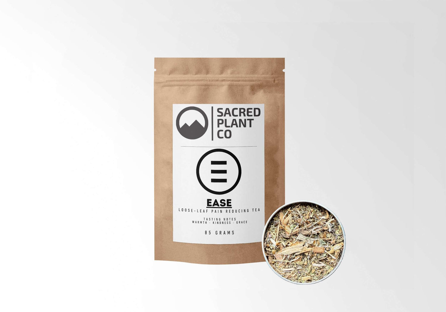 Sacred Plant Co Ease Herbal Tea 85 grams in eco-friendly kraft paper packaging with a sample in a silver tin, designed to reduce pain naturally, featuring warming and soothing herbal notes.
