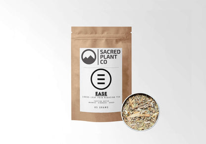 Sacred Plant Co Ease Herbal Tea 85 grams in eco-friendly kraft paper packaging with a sample in a silver tin, designed to reduce pain naturally, featuring warming and soothing herbal notes.