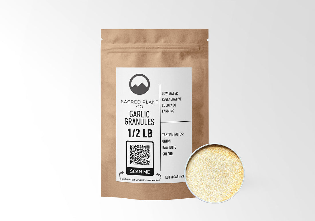 Sacred Plant Co Garlic Granules 1/2 LB in eco-friendly kraft paper packaging, with a sample in a silver tin. Used for supporting cardiovascular health, boosting immune function, and adding a rich, savory flavor to culinary dishes.