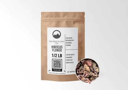 Sacred Plant Co Hibiscus Flower 1/2 LB in kraft paper packaging with a sample of herb in a silver tin, highlighting its use for supporting cardiovascular health and promoting relaxation.