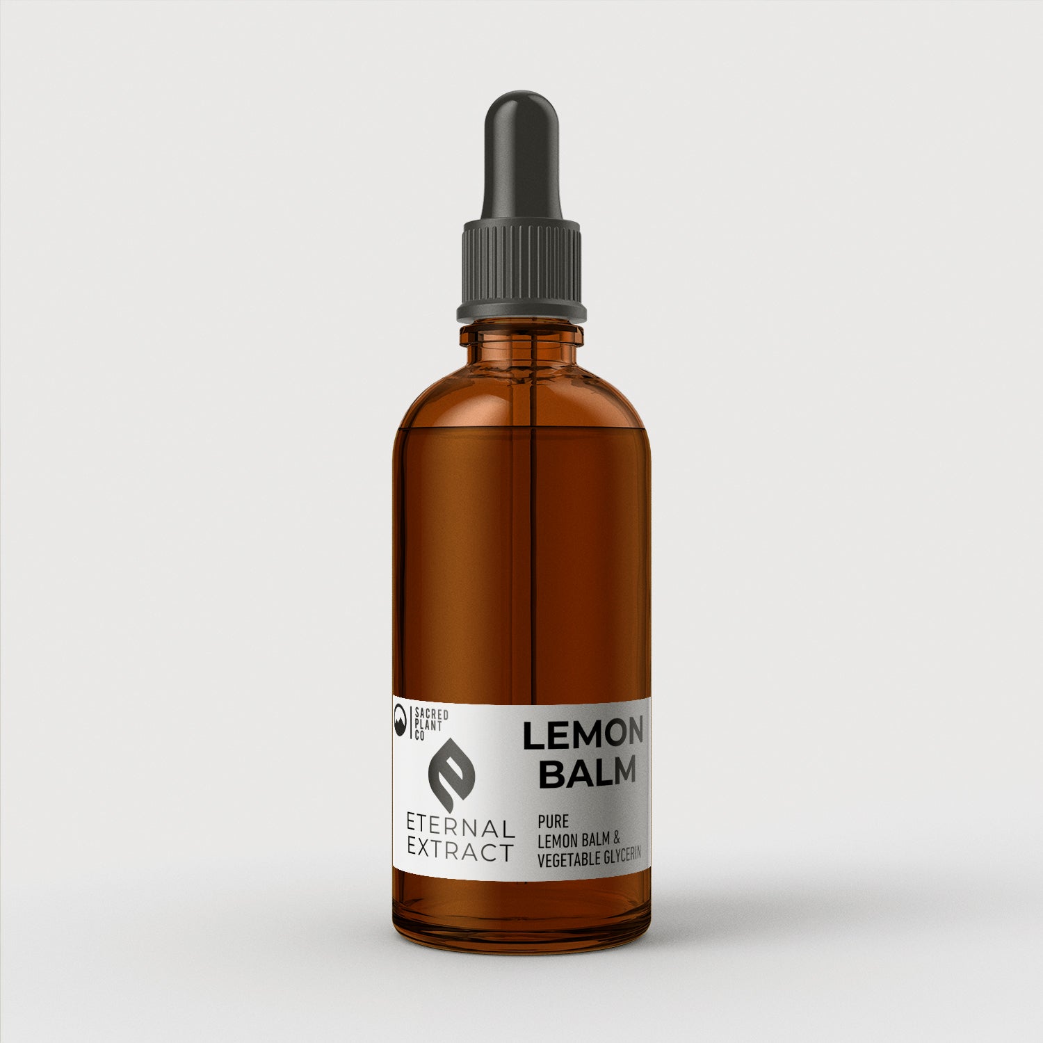 Sacred Plant Co Lemon Balm Tincture in an amber dropper bottle, labeled &