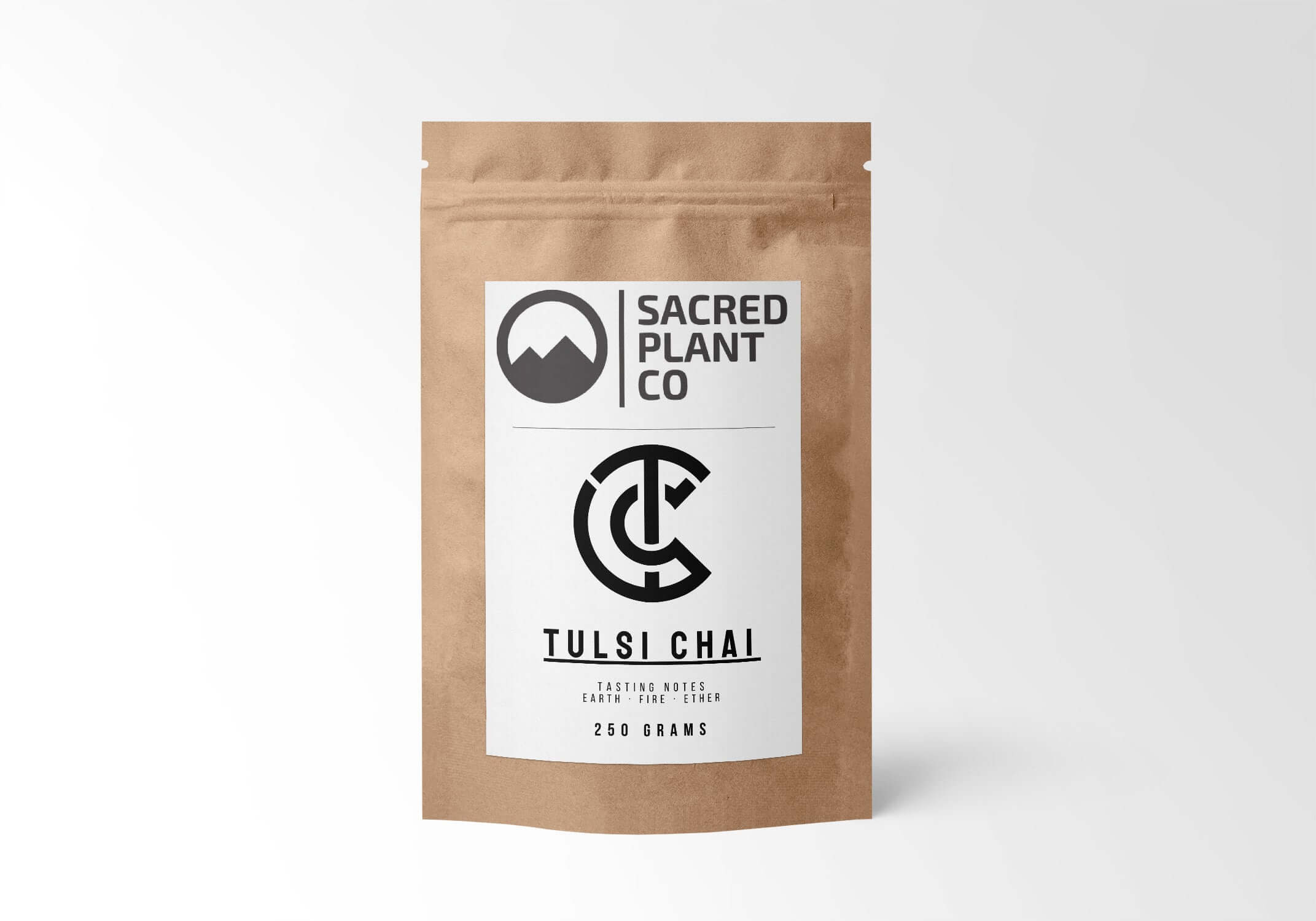 Sacred Plant Co Tulsi Chai Tea in eco-friendly kraft paper packaging, 250 grams, herbal blend for promoting relaxation and health wellness.