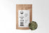 Sacred Plant Co Mugwort Herb 1/2 LB kraft paper packaging with sample in silver tin showcasing sustainably grown herb for use in digestive health and enhancing dream experiences.
