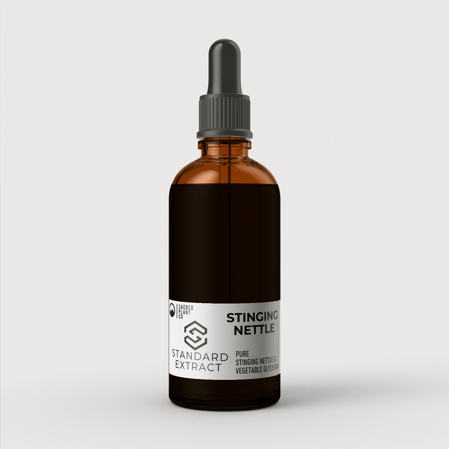 A 30ml bottle of Sacred Plant Co Standard Stinging Nettle Extract Tincture with a black dropper cap on a simple background.
