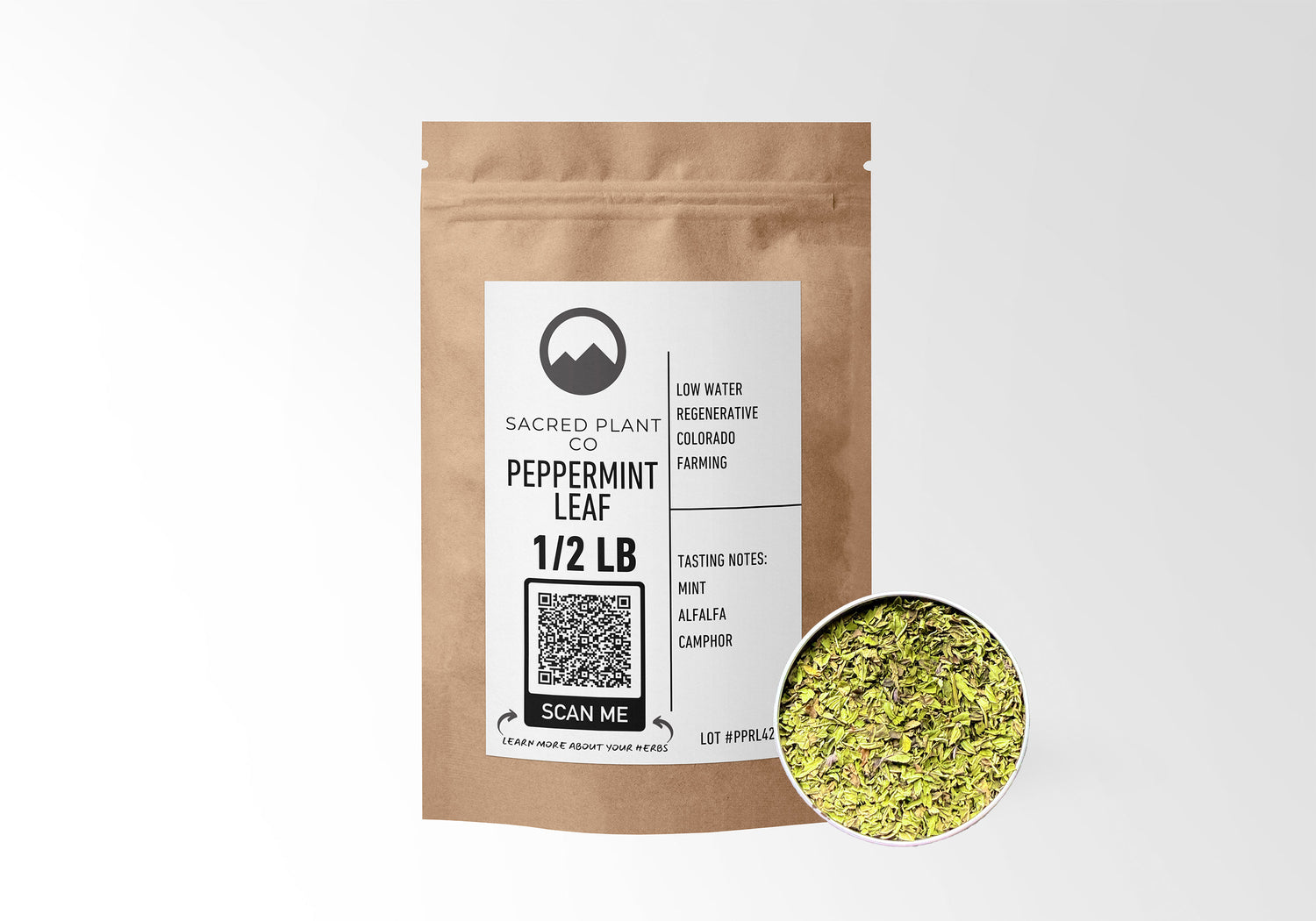 Sacred Plant Co Peppermint Leaf 1/2 LB in eco-friendly kraft paper packaging, showcasing a sample of the herb in a silver tin, great for digestive support and soothing relief.