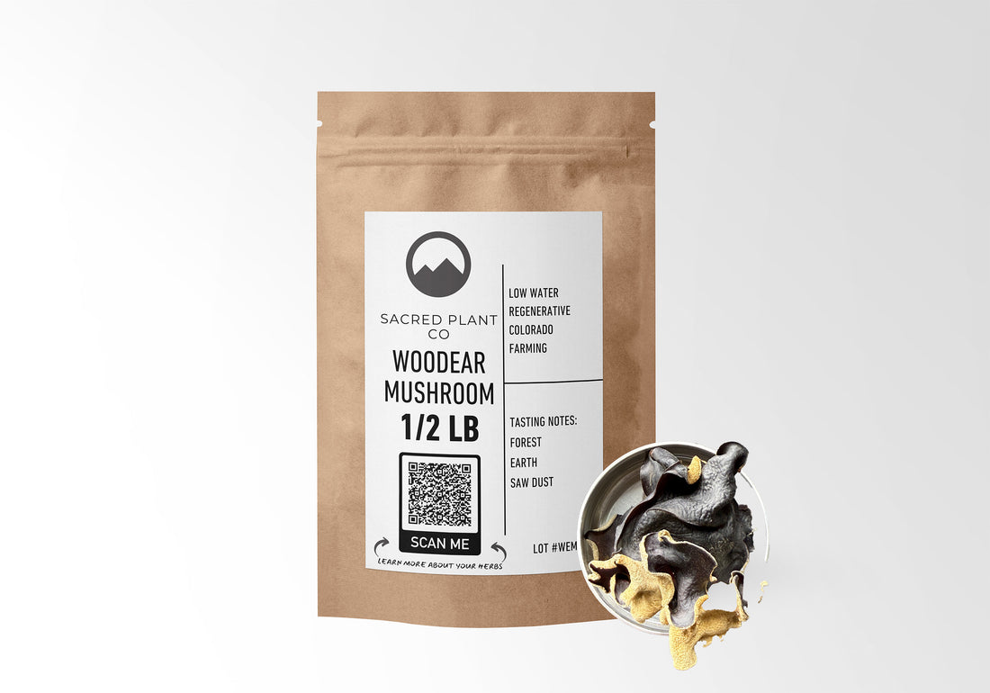 Sacred Plant Co Woodear Mushroom 1/2 LB in eco-friendly kraft paper packaging, sample in a silver tin, known for supporting immune health and promoting cardiovascular wellness.