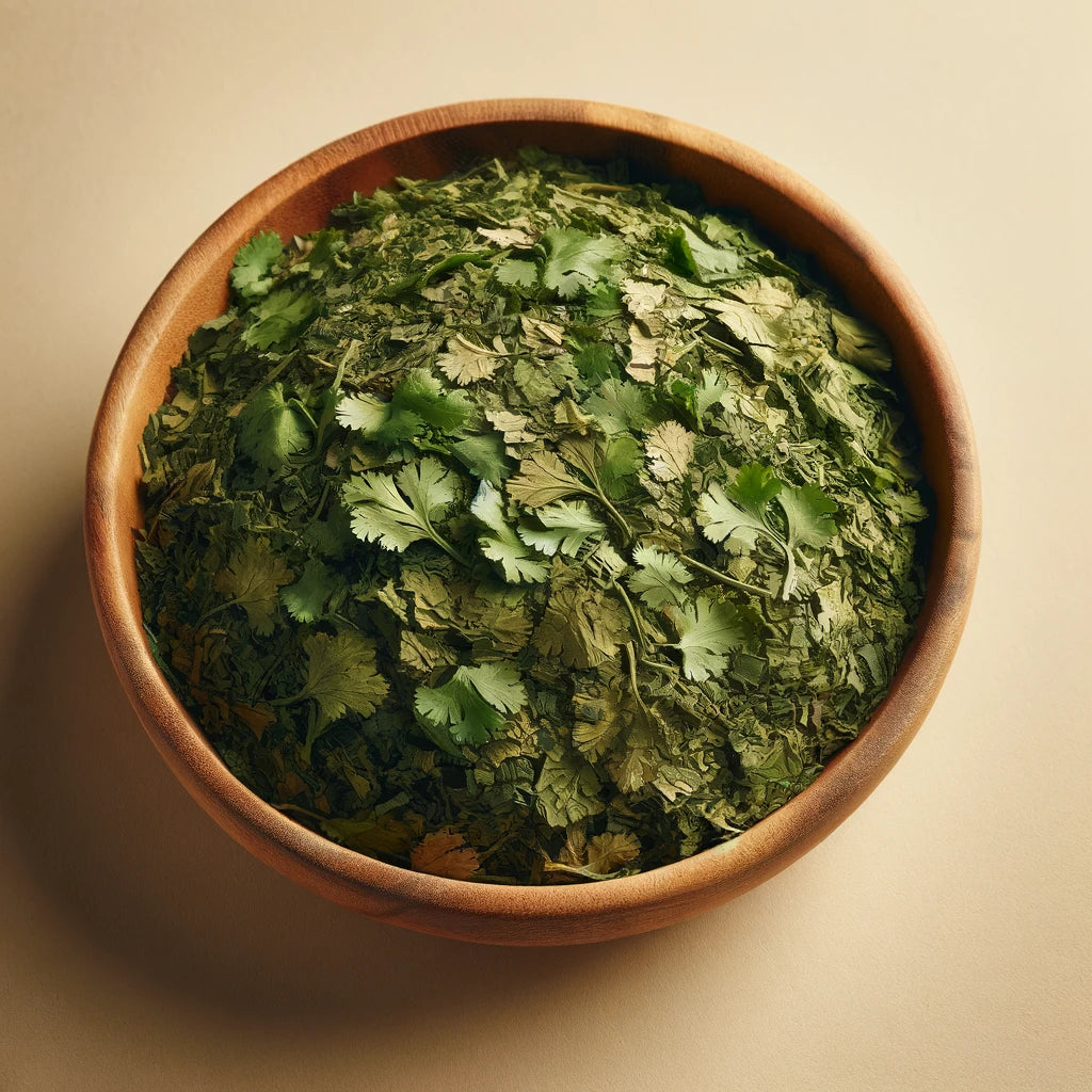 A bowl filled with dried cilantro leaves, displaying a range of green color variations and the distinct texture of the herb, against a neutral beige background to highlight the leaves.