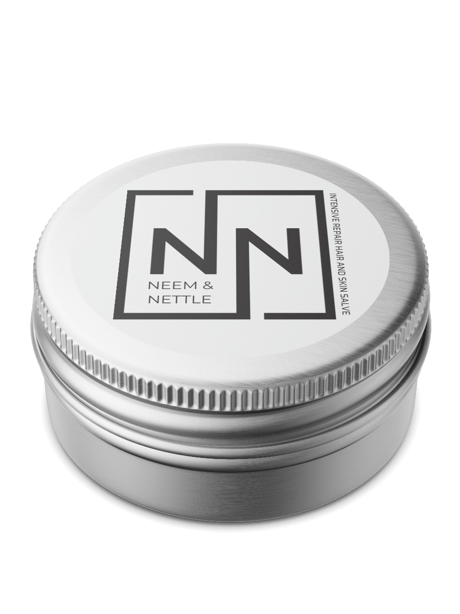 Neem &amp; Nettle Salve tin from Sacred Plant Co, a hair and skin repair salve, highlighting the natural ingredients in a sleek metal container with a modern, minimalist label design.