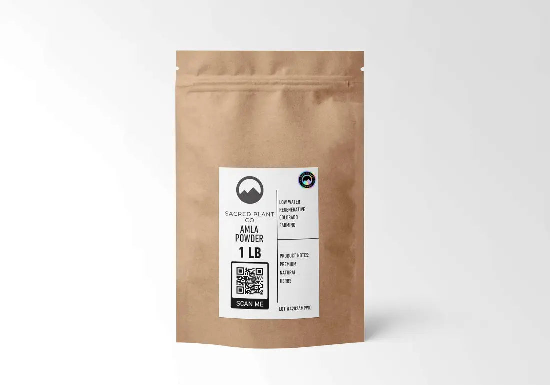 Sacred Plant Co organic amla powder in a 1 lb resealable kraft pouch, featuring a black and white label with QR code and mountain logo.