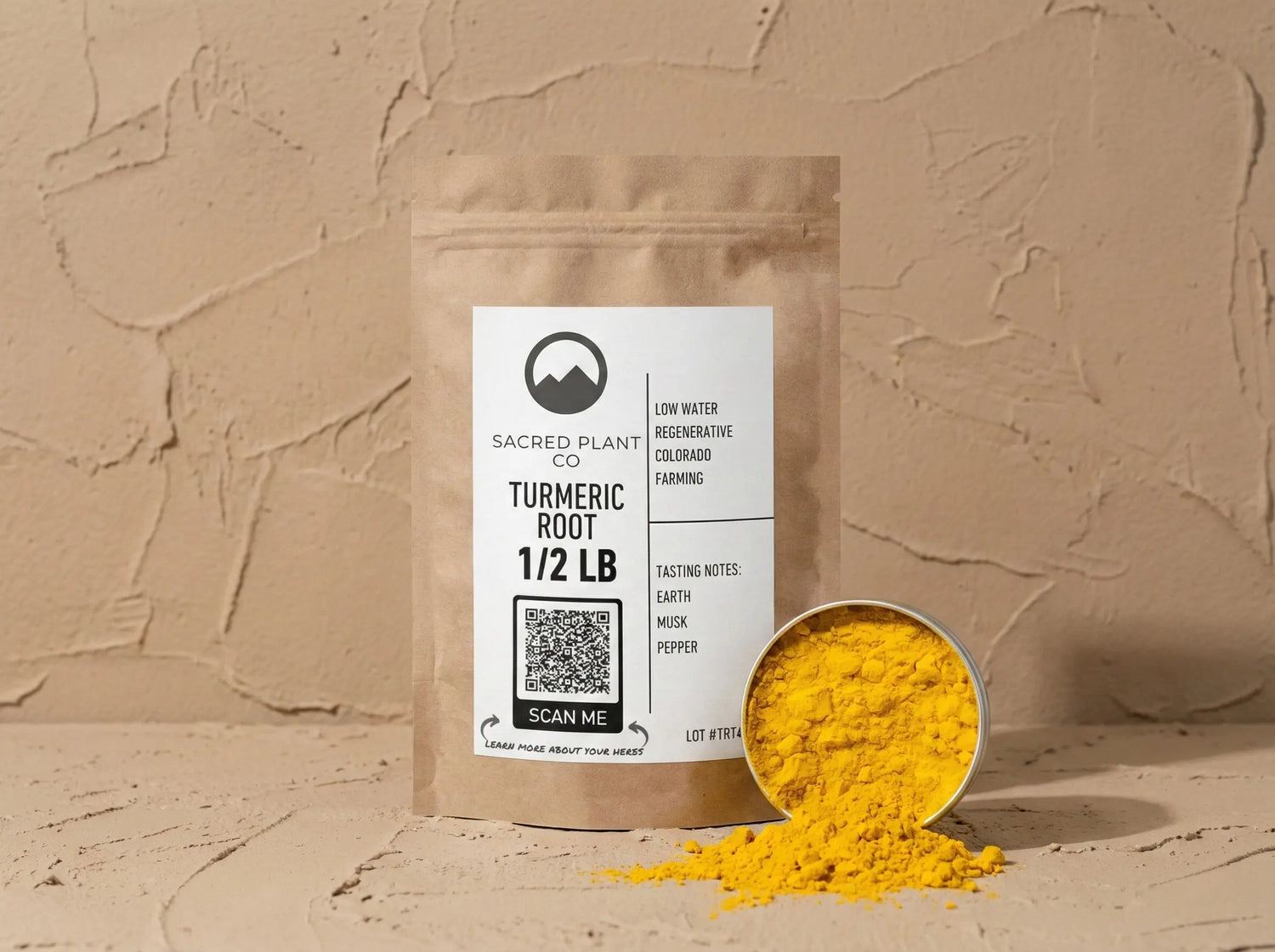Sample of sacred plant co bright orange turmeric next to product bag. 