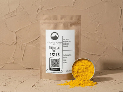 Sample of sacred plant co bright orange turmeric next to product bag. 
