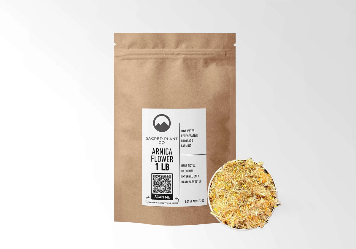 Sacred Plant Co Arnica Flowers 1 LB kraft stand-up pouch shown with a sample of the herb.