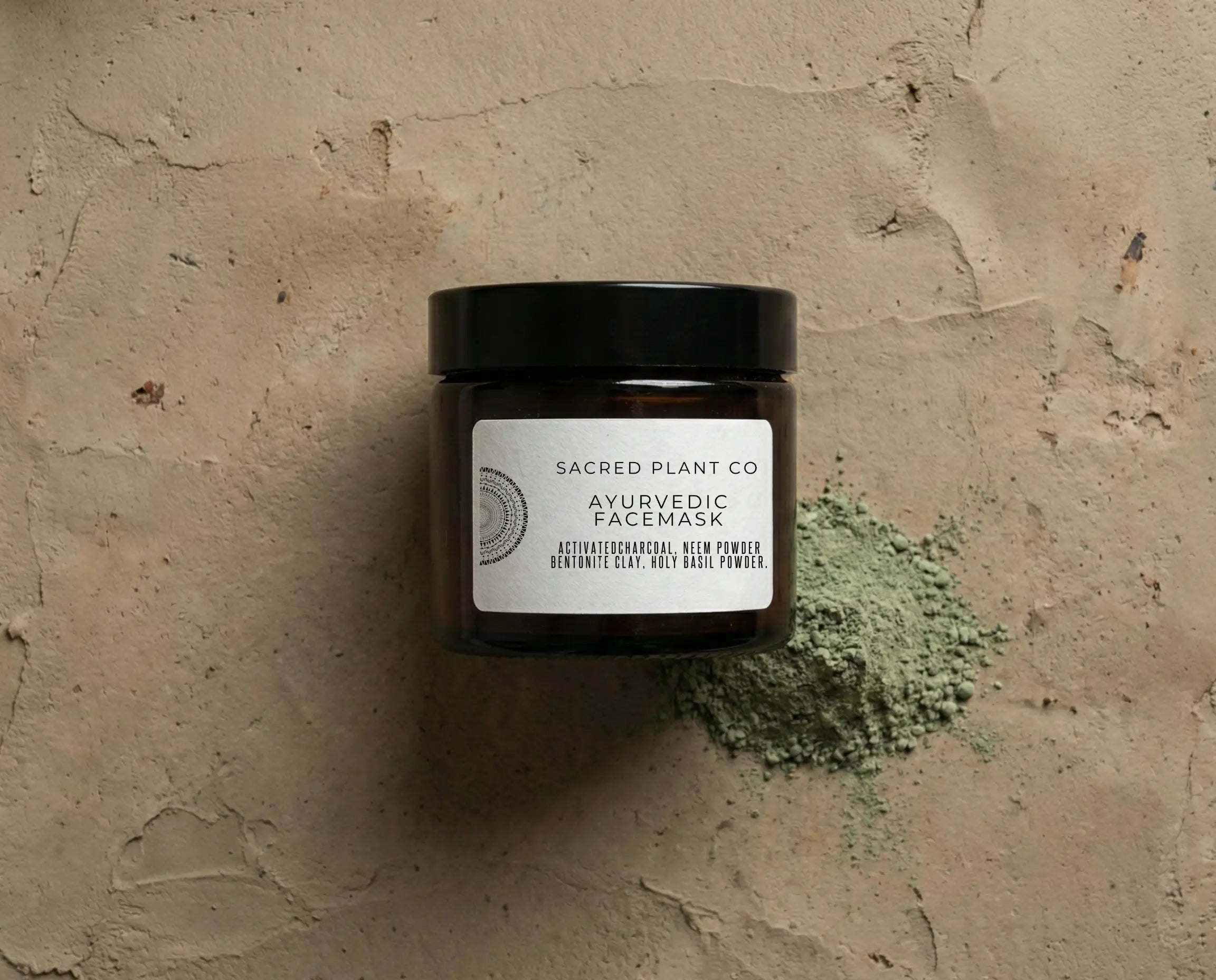 Top-down view of Sacred Plant Co Ayurvedic Face Mask jar revealing the fine texture of sustainably harvested neem and bentonite clay.