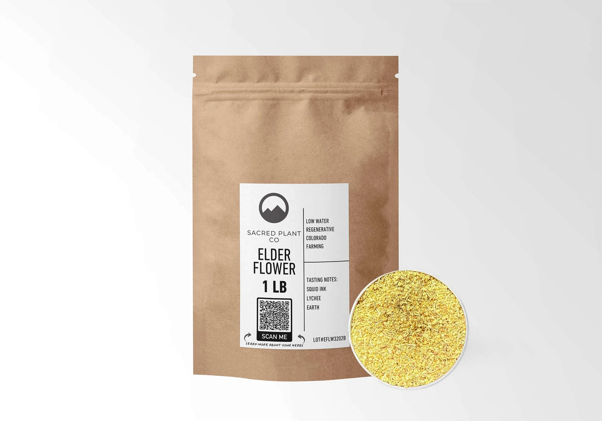 Sacred Plant Co Elder Flowers 1 LB kraft stand-up pouch shown with a sample of the herb.