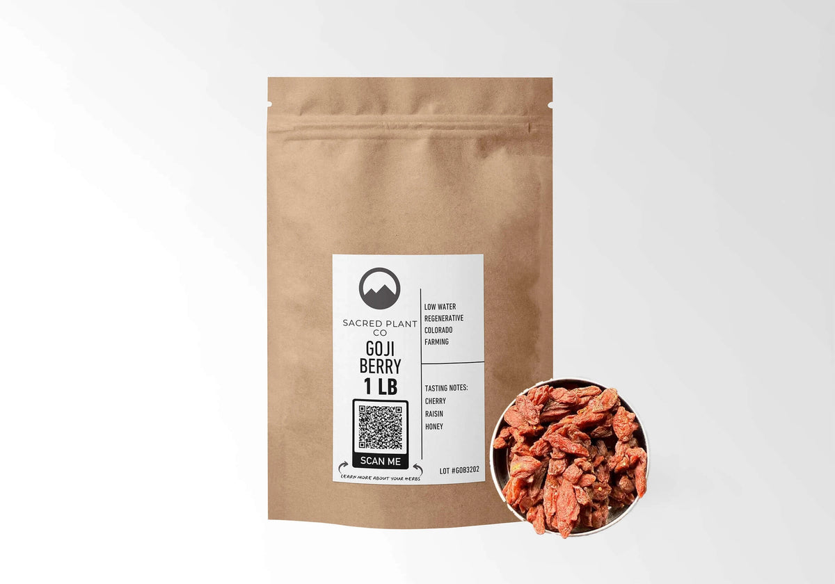 Sacred Plant Co Goji Berries 1 LB kraft stand-up pouch shown with a sample of the berries.