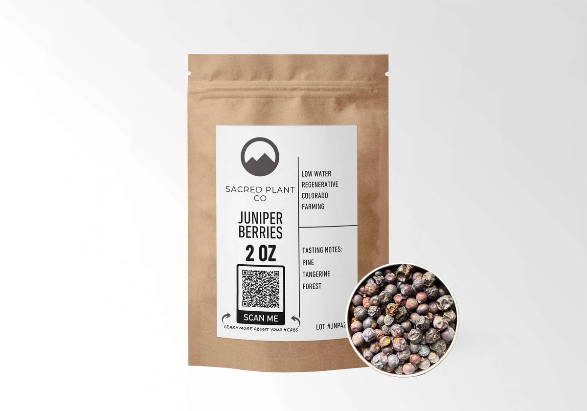Sacred Plant Co Juniper Berries 2 oz in a kraft stand-up pouch with a sample of whole dried juniper berries in a silver tin, naturally grown with low-water regenerative Colorado farming.