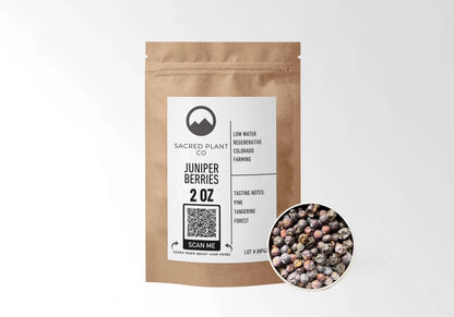 Sacred Plant Co Juniper Berries 2 oz in a kraft stand-up pouch with a sample of whole dried juniper berries in a silver tin, naturally grown with low-water regenerative Colorado farming.