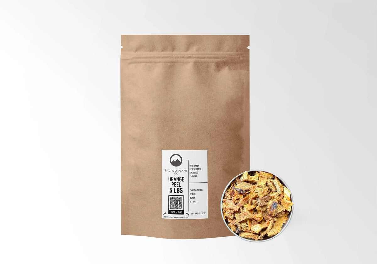 Sacred Plant Co Orange Peel 5 LBS kraft stand-up pouch shown with a sample of the peel.