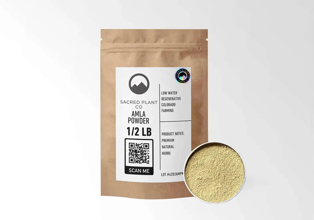 Sacred Plant Co Organic Amla Powder 1/2 LB kraft stand-up pouch shown with a sample of the powder.