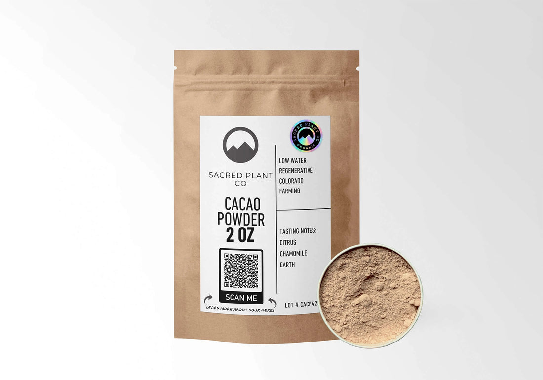 Sacred Plant Co Organic Cacao Powder 2 oz in a kraft stand-up pouch with a sample in a silver tin.