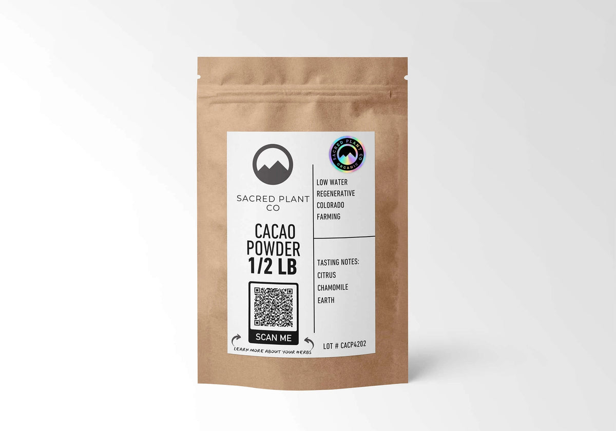 Sacred Plant Co Organic Cacao Powder 1/2 LB in a kraft stand-up pouch with the holographic organic seal on the label.