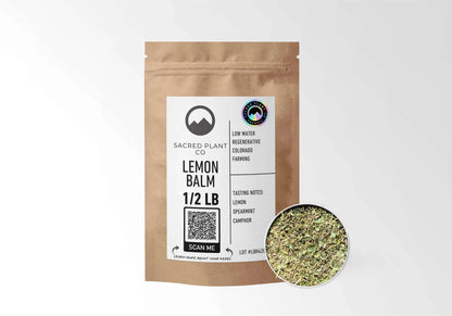 Sacred Plant Co Organic Lemon Balm 1/2 LB kraft stand-up pouch shown with a sample of the herb.