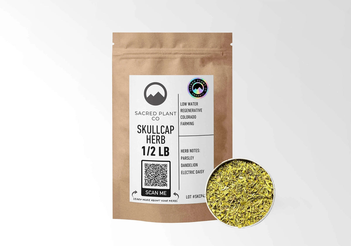Sacred Plant Co Organic Skullcap 1/2 LB kraft stand-up pouch shown with a sample of the herb.