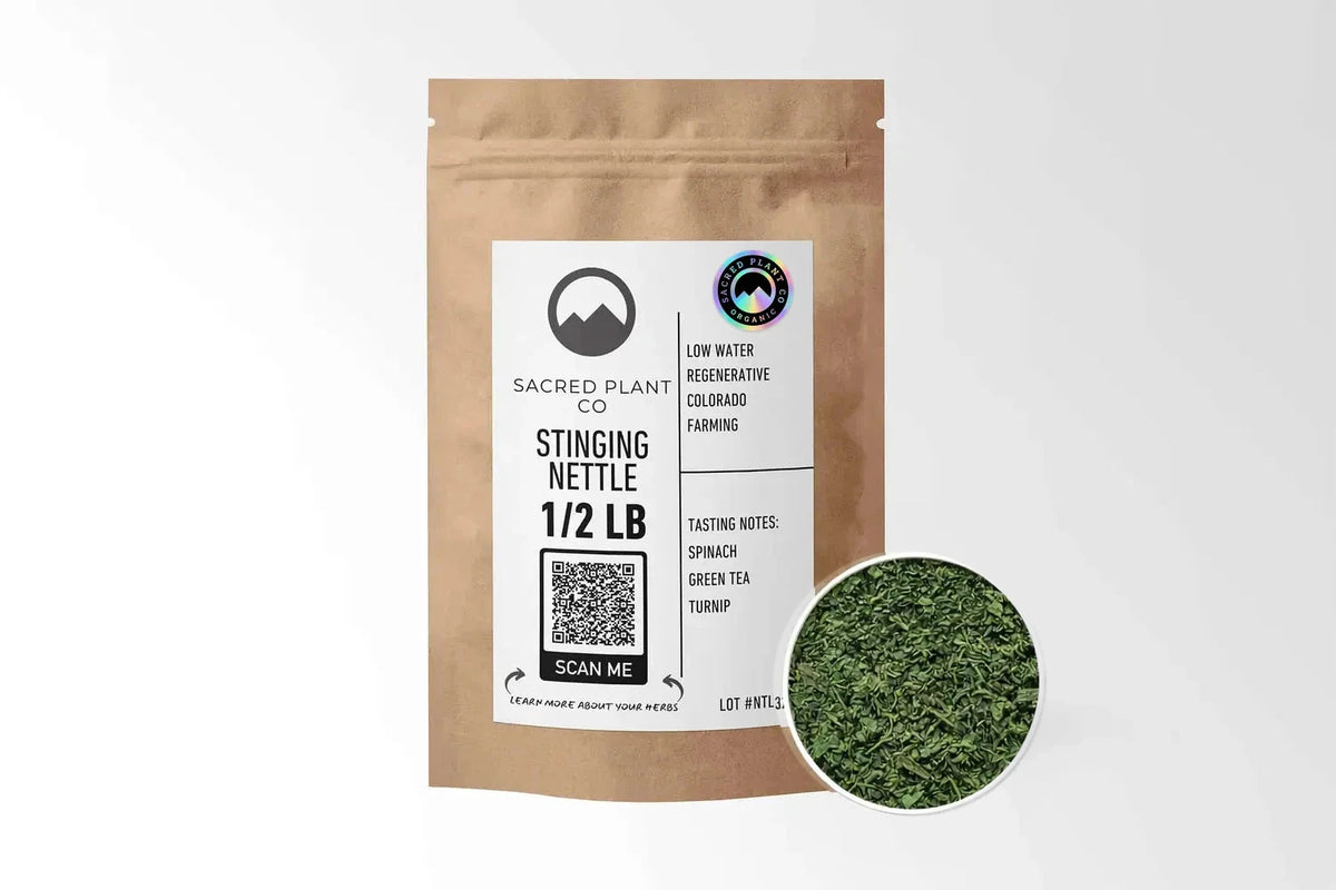 Sacred Plant Co Organic Stinging Nettle Leaf 1/2 LB kraft stand-up pouch shown with a sample of the herb.