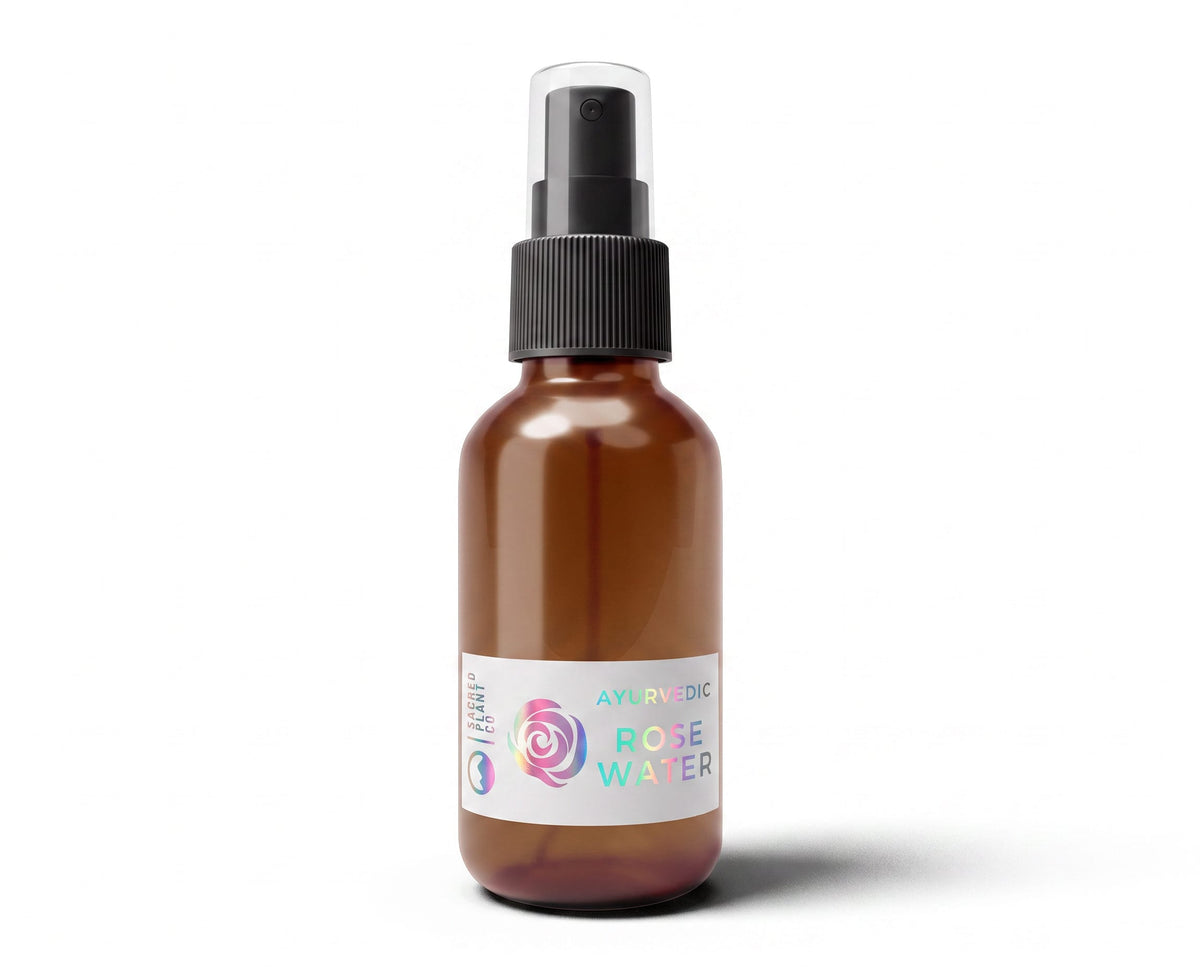 Sacred Plant Co steam-distilled rose hydrosol in a 2 oz amber glass spray bottle, front view with holographic rose label.