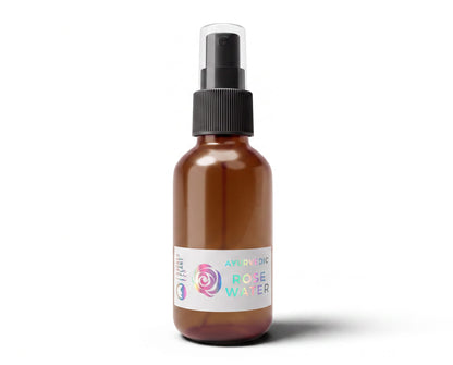 Sacred Plant Co steam-distilled rose hydrosol in a 2 oz amber glass spray bottle, front view with holographic rose label.