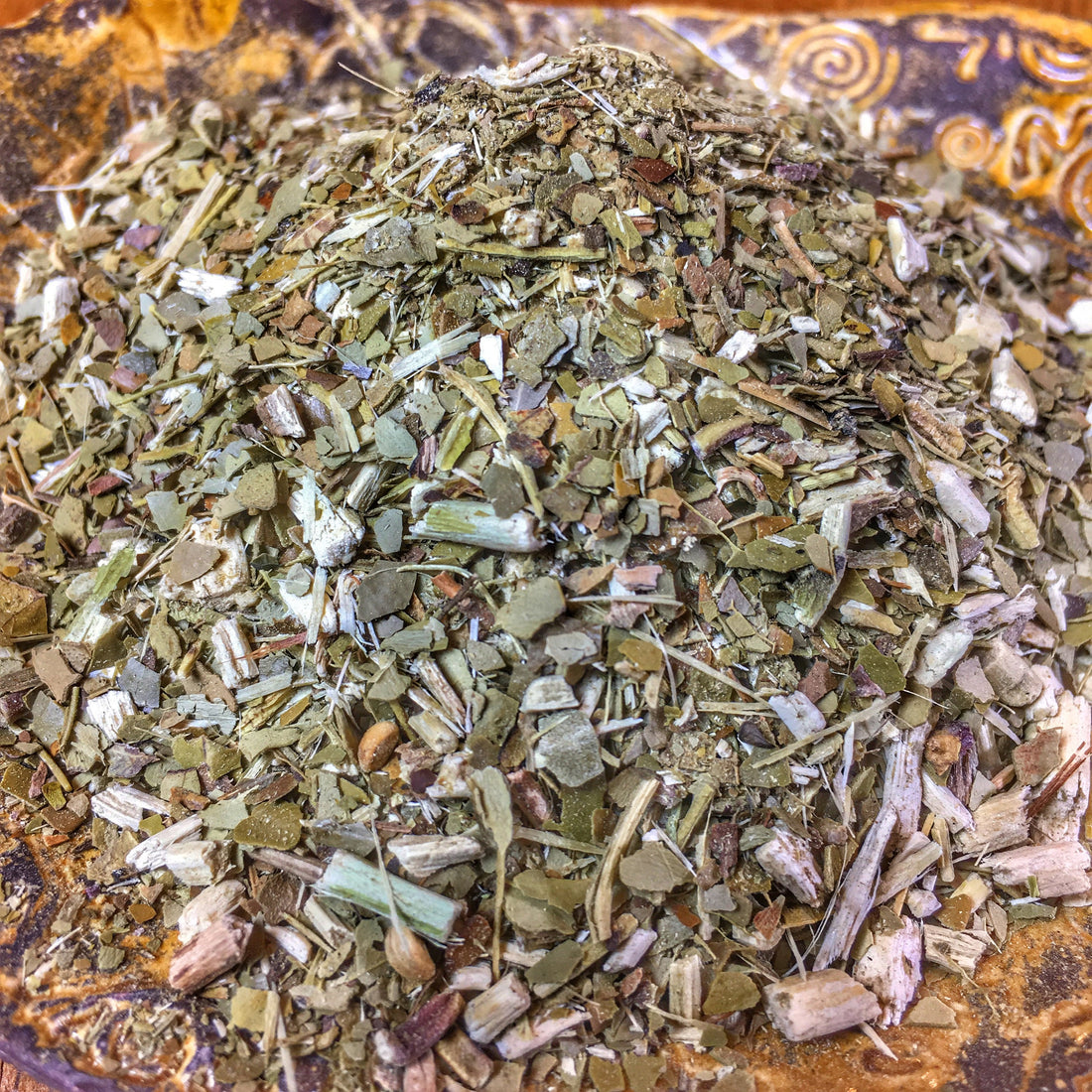 Dried Yerba Mate leaves, Ilex paraguariensis, for chimarrão, close-up of traditional South American herbal tea.