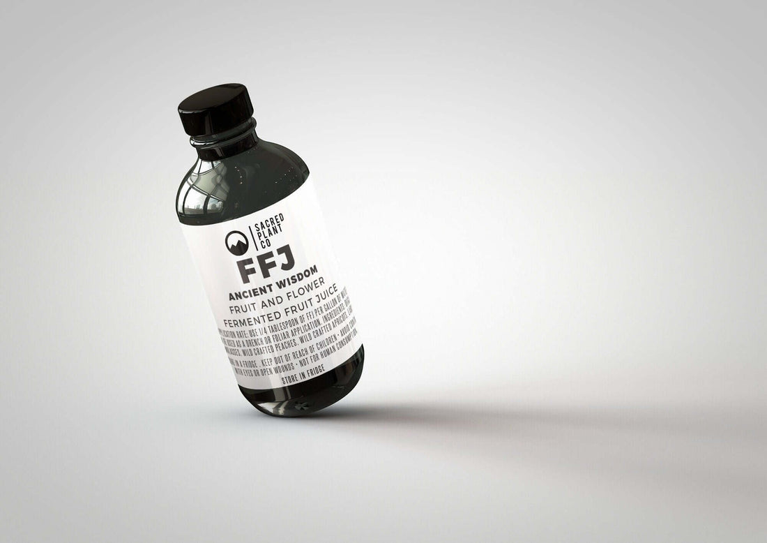 Tilted bottle of our nutrient-rich FRUIT & FLOWER - FFJ, proudly produced at Low Water Colorado Mountain Herb Farm