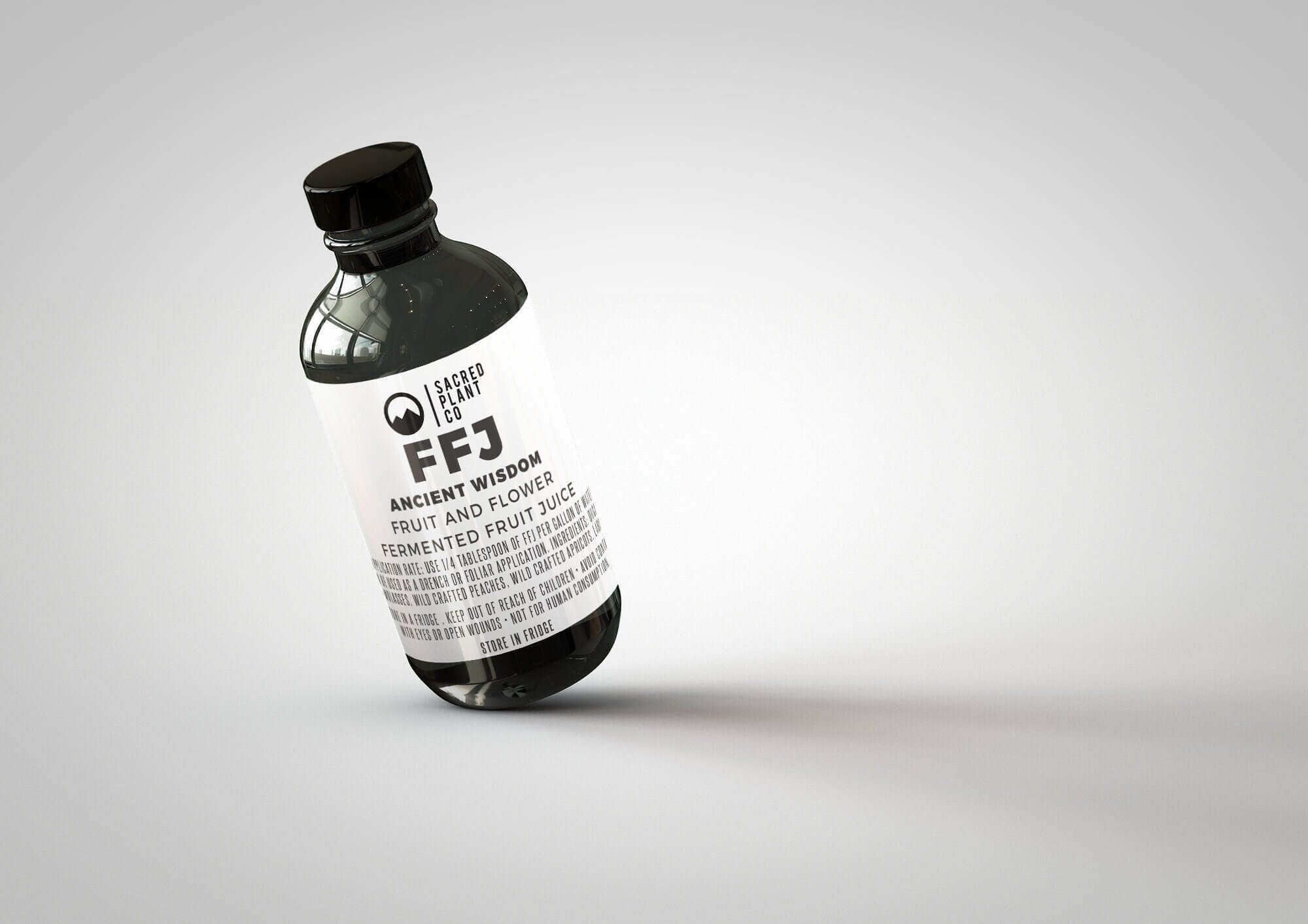 Tilted bottle of our nutrient-rich FRUIT &amp; FLOWER - FFJ, proudly produced at Low Water Colorado Mountain Herb Farm
